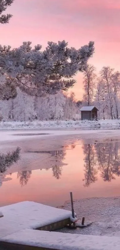 Scenic winter landscape with pink sky and snowy trees reflecting in a calm lake.