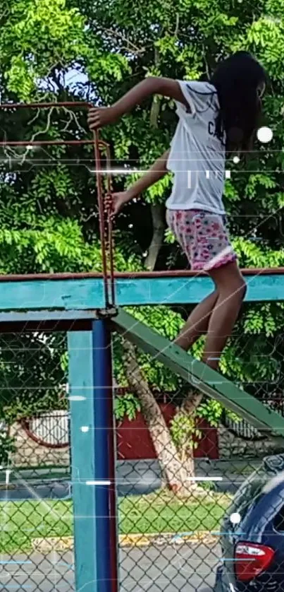 Child climbing on colorful playground with green trees in the background.