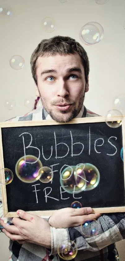 Man holding chalkboard with bubbles around.