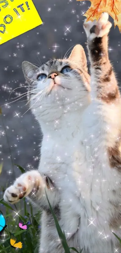 Cat reaching for autumn leaf with sparkles and 'Just Do It' text.