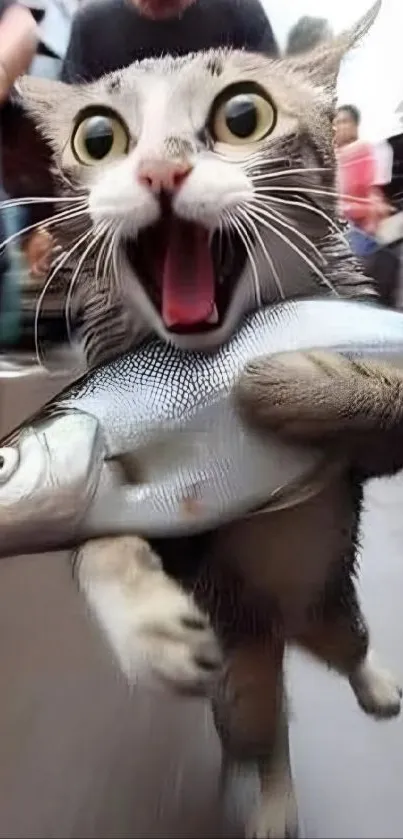 A playful cat excitedly holding a large fish, bringing a humorous touch to mobile screens.