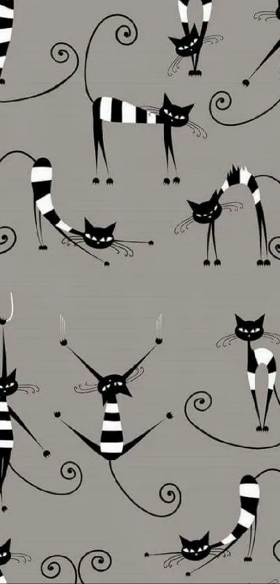 Playful black and white cats on gray wallpaper for phones.