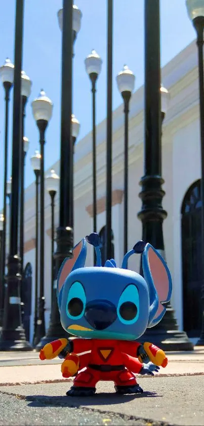 Blue cartoon figurine in urban setting with street lamps.