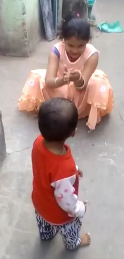 Child taking first steps outdoors in a colorful courtyard.