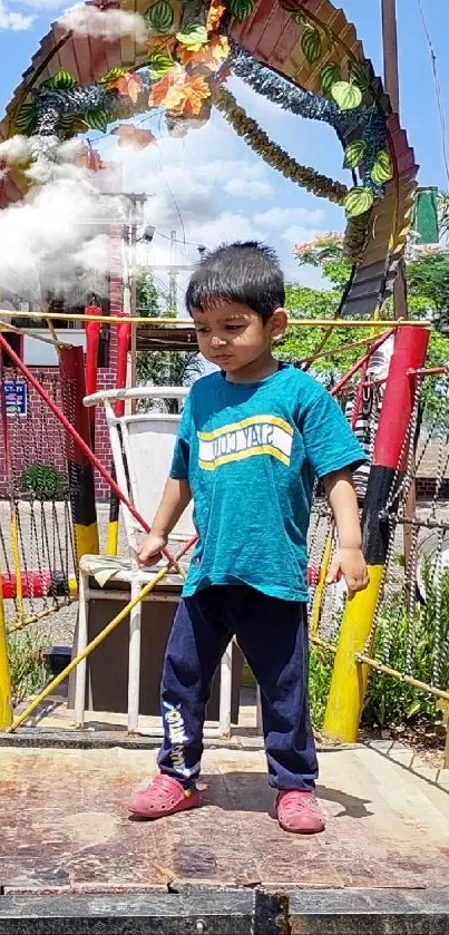 Child on a colorful playground bridge with greenery in the background.