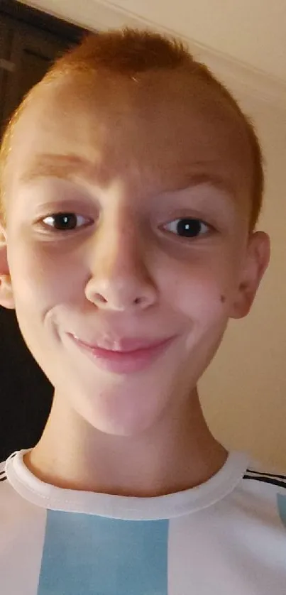 Mobile wallpaper featuring a playful smiling portrait.