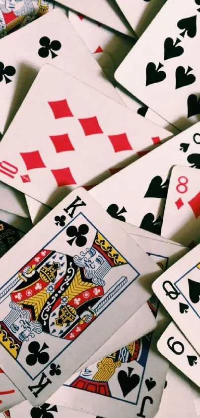 Scattered playing cards wallpaper for mobile phones.