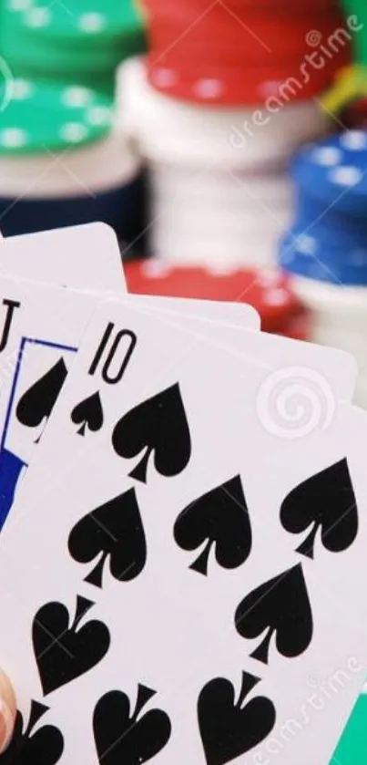 Poker hand with chips on a green table.