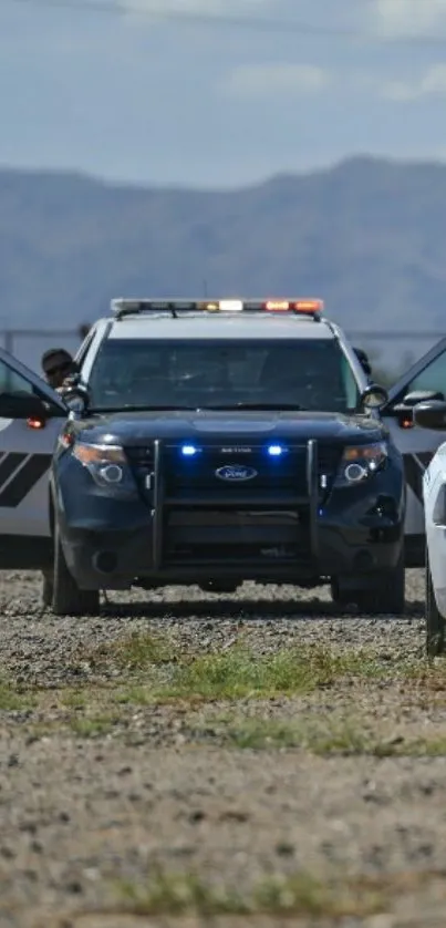 Police cars on a rocky desert terrain, showcasing a dynamic and adventurous scene.