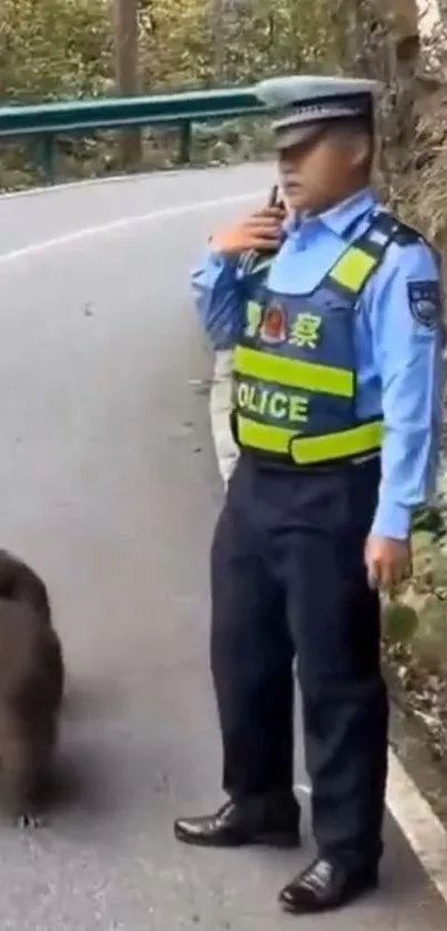 Police officer and monkey on forest road.