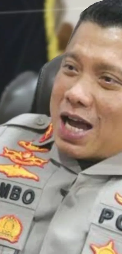 Police officer in uniform with badges and insignia.