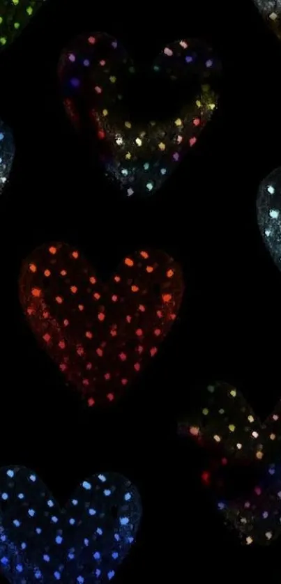 Colorful polka dot hearts on black background wallpaper.