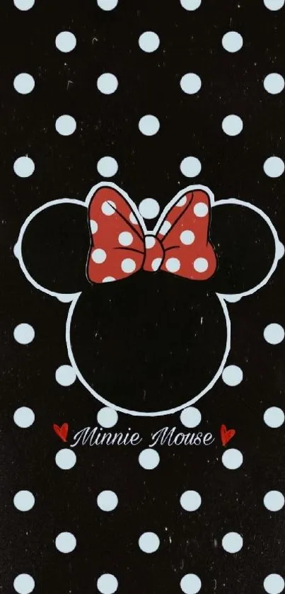 Minnie Mouse silhouette with red polka dot bow on black background.