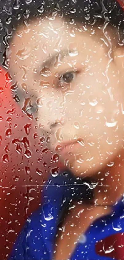 Blurred portrait behind water drops on a vibrant phone wallpaper.