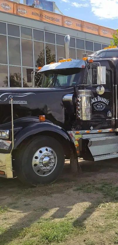 A powerful truck parked outside a Harley Davidson building.