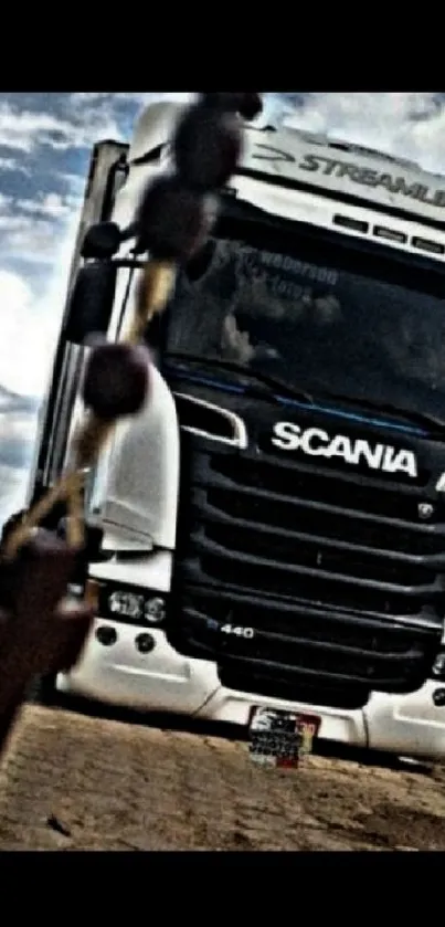 White truck on a scenic road with black accents.