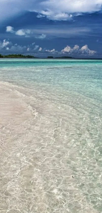 Serene beach with turquoise waters and vibrant sky.