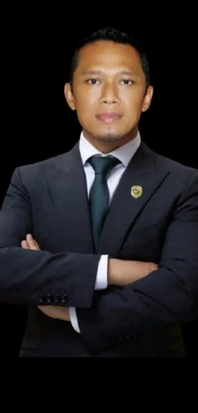 Professional man in a suit on a black background.