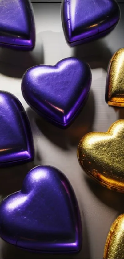 Vibrant wallpaper with purple and gold heart shapes on a sleek background.