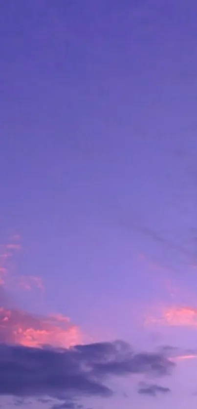 Purple and pink sunset sky with soft clouds