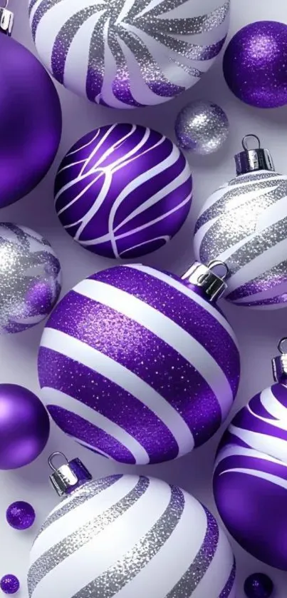 Purple and silver Christmas ornaments with festive design.