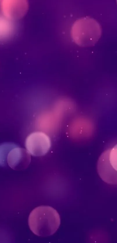 Purple bokeh wallpaper with dreamy blurred circles.