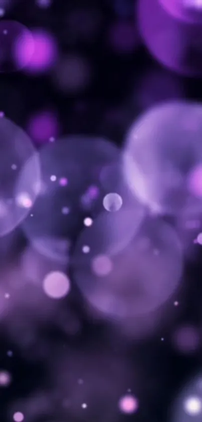 Purple bokeh wallpaper with soft luminous circles.