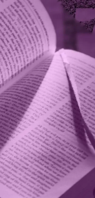 Purple book-themed wallpaper with open pages and artistic details.