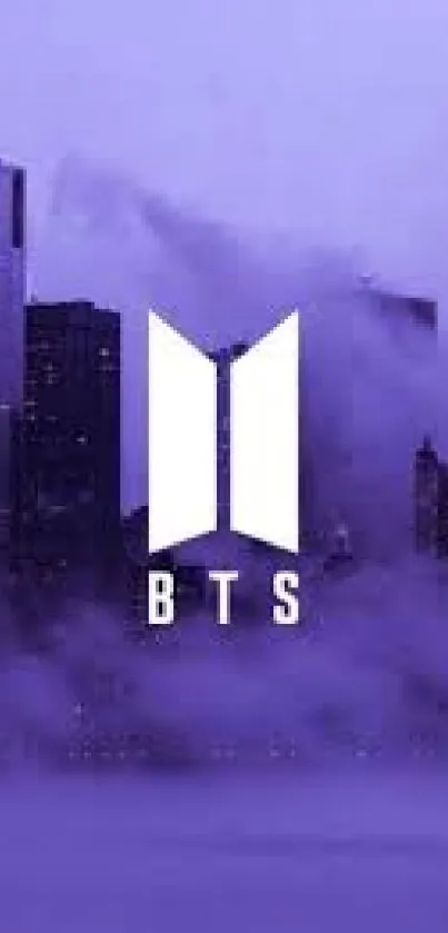 BTS logo on a purple cityscape wallpaper, perfect for mobile.