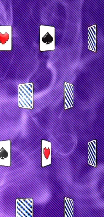 Purple wallpaper with floating playing cards and smoke design.