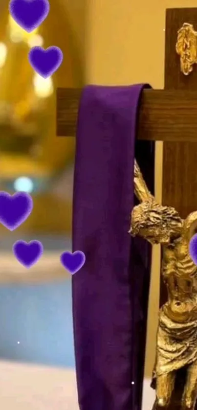 Wooden cross with purple cloth and heart accents.