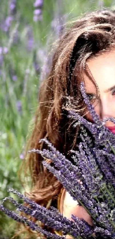 Woman in lavender field holding flowers