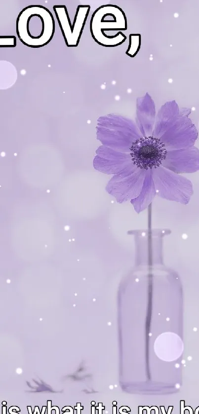 Purple flower in vase with inspirational quote on mobile wallpaper.