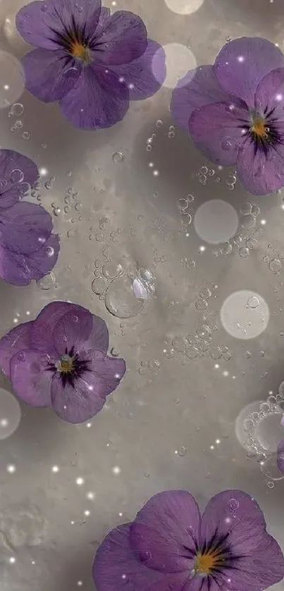 Purple flowers with water droplets on a mobile wallpaper.