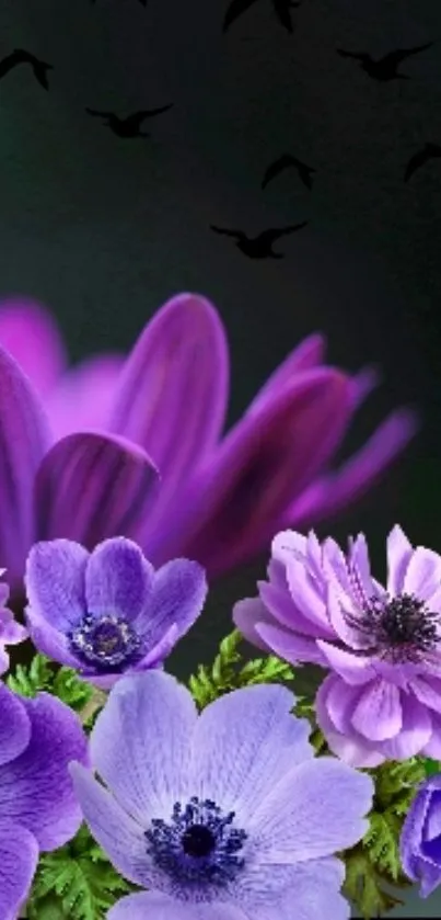 Purple flowers with birds against dark sky.