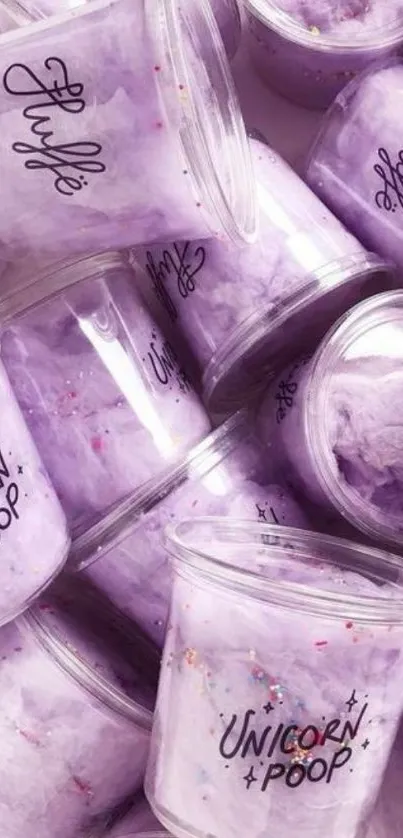 Purple fluffy cotton candy in unicorn cups.