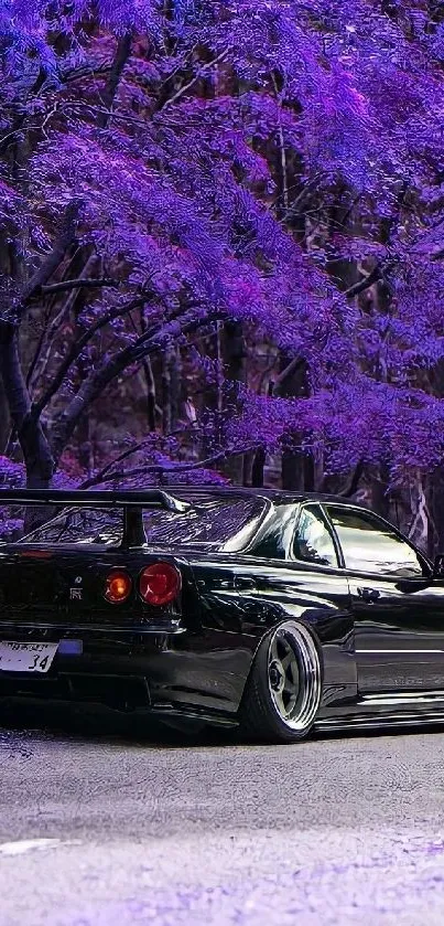 Black sports car in purple forest setting.