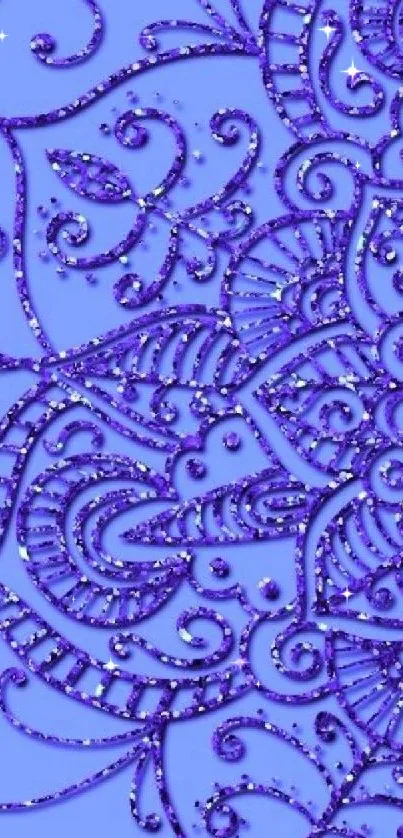 Intricate purple glitter design on a blue background wallpaper.