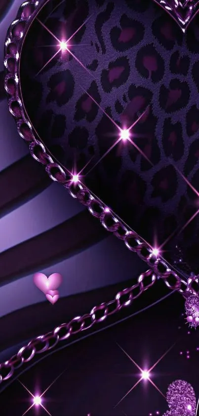 Purple heart with glitter and chain details on wallpaper background.