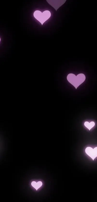 Glowing purple hearts on a dark background wallpaper.