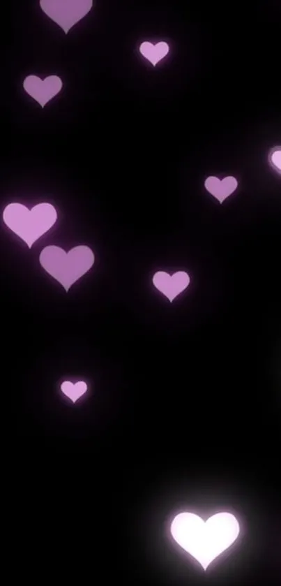 Purple heart shapes on a black background wallpaper.