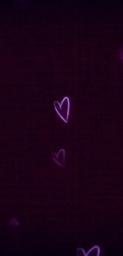 Vibrant purple heart mobile wallpaper with glowing patterns on a dark background.