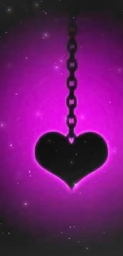 Black heart pendant on a glowing purple neon background.