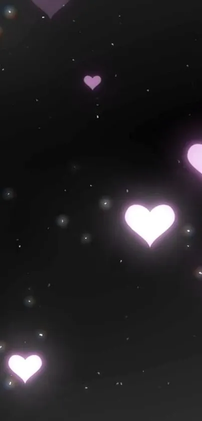 Mobile wallpaper with glowing purple hearts against a black night sky.