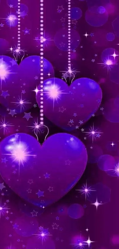 Purple hearts with sparkle and bokeh effect wallpaper.