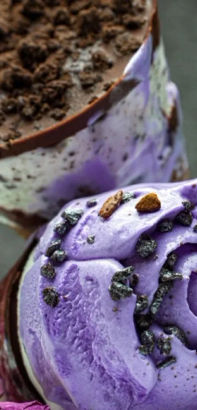 Purple ice cream cone with chocolate pieces.