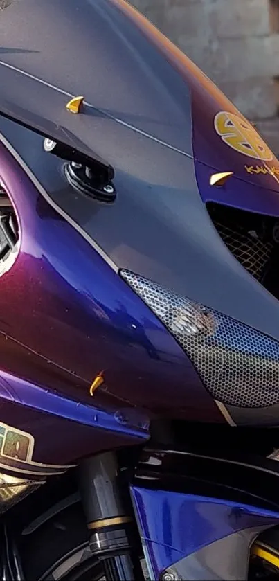 Close-up of a purple motorcycle with sleek, metallic design accents.