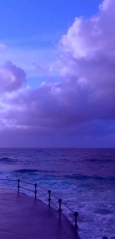 Purple ocean view with dramatic clouds and waves, perfect for a calming mobile wallpaper.