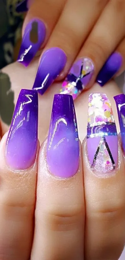 Elegant purple gradient nail art design with stylish and trendy elements.