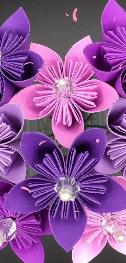 Mobile wallpaper of beautiful purple origami flowers on a dark background.